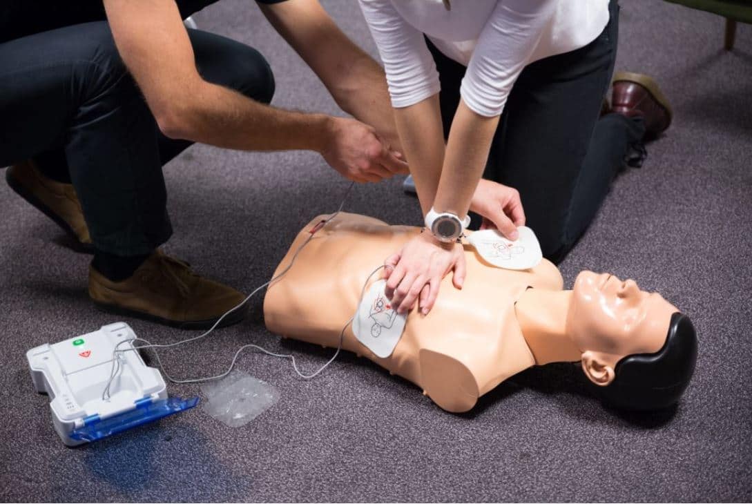 Hands-on CPR and AED practice on a training manikin